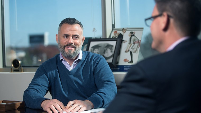 two men discussing work