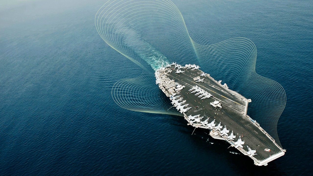 aircraft carrier with jets parked on the runway