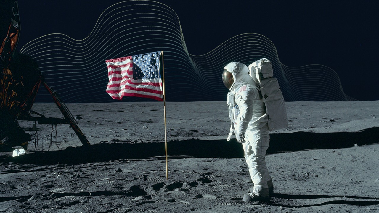 man on the moon looking at American flag