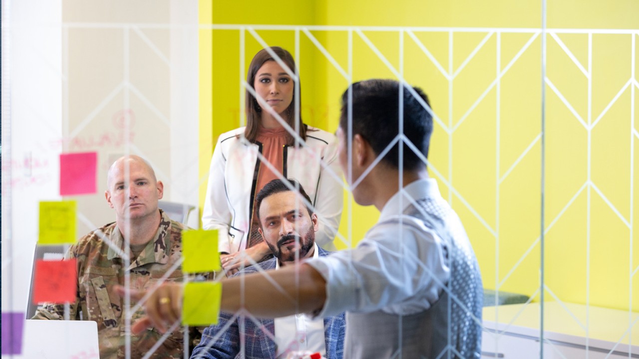 Group of people discussing ideas in a meeting room 