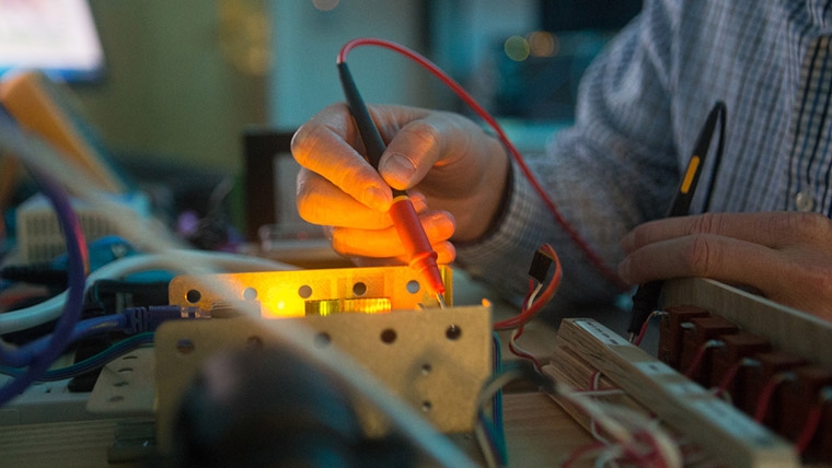 person using tools to engineer