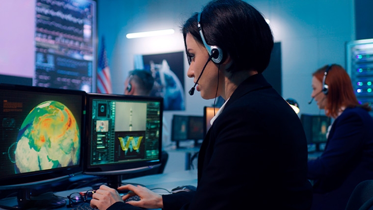 woman on headset tracking satellite